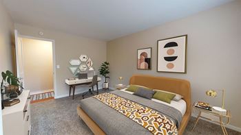 a bedroom with a bed and a desk